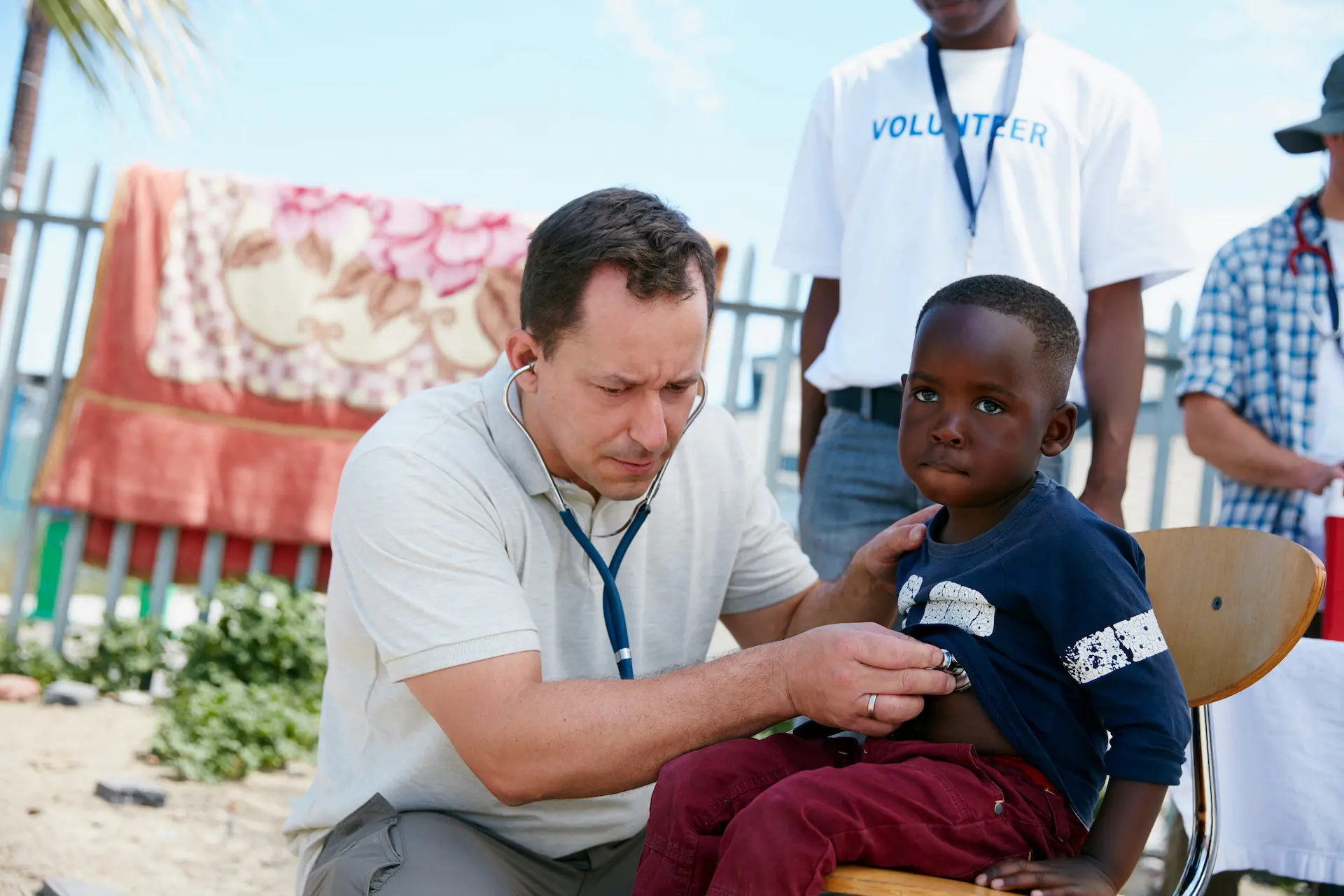shot-of-a-volunteer-doctor-examining-a-young-patie-2022-10-05-07-52-38-utc.webp